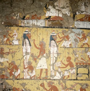 A detail of a painting in the tomb of Ipy depicting carpenters and painters finishing two anthropoid coffins