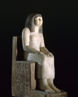 A statue of a seated woman, the royal acquaintance Nynefert min, the wife of an official