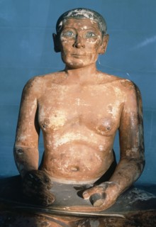 The Scribe du Louvre shows a man in the typical squatting posture of a scribe with a roll of papyrus on his lap