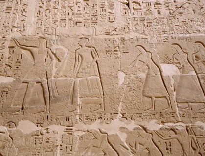 Relief depicting priests scribes and captives being presented to Ramesses III, from his mortuary temple