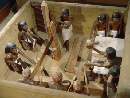 Wooden model of a carpentry workshop with craftsmen at work