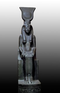 A statue of Isis, sister wife of Osiris, god of the dead, seated on a throne