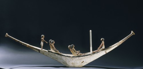 A model of a rowing boat with crew and two steering posts