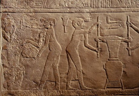 Bas relief from the tomb of Pairkep showing servant women squeezing oil from lilies in a press for use in perfume