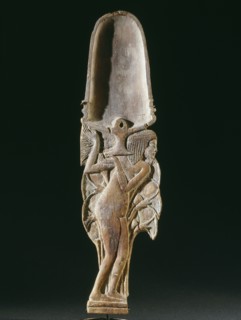 Cosmetic spoon in the form of a young woman in a papyrus thicket supporting a vessel heaped with unguent