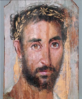 Portrait of a man wearing wreath of applied gold leaf
