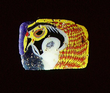 Glass fragment with falcon head