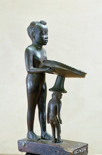 Ebony statuette of a naked black girl carrying a tray, A monkey stands beside her