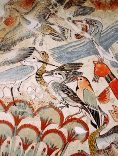 A detail of a painting from the tomb of Nebamun showing him standing on a reed boat hunting birds in the papyrus marshes using throwsticks and three decoy herons