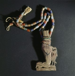A pendant of gold attached to a string of beads