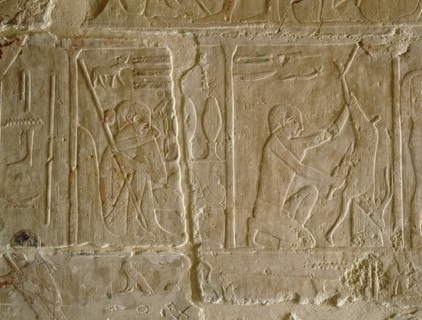 A relief in the tomb of Kagemni depicting a man butchering an animal, perhaps an antelope