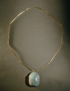 Heart scarab pendant, inscribed on reverse with chapter 26 of the Book of the Dead, from the tomb of General Wen Djeba En Djed, senior official of Psusennes I