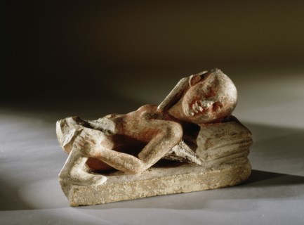 A reclining prostitute with one leg of her client remaining
