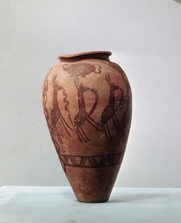 An urn decorated with a design of stylised giraffes