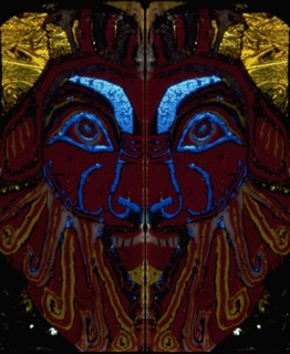 Glass fragments, two half faces of Bes