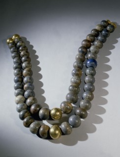 Necklace of double strands of lapis lazuli beads, with gold clasp and two gold beads at centre