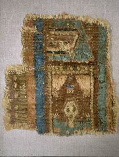 Fragment of a Coptic carpet depicting a person praying in a small room