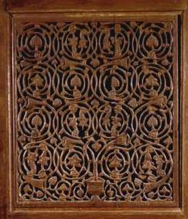 Detail of a door with vines and foliage decoration