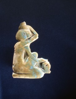 Turquoise glass of a kneeling mourning goddess, possibly Isis or Nephthys
