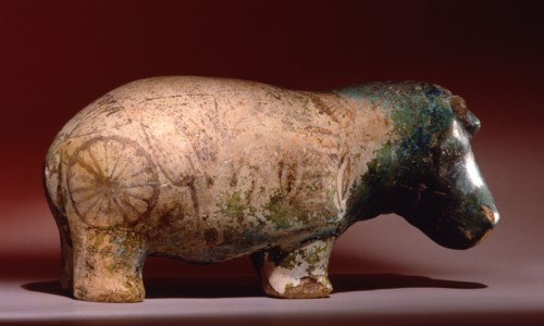 Statuette of hippopotamus from a burial, with depictions of marsh plants on his body