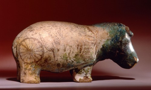 Statuette of hippopotamus from a burial, with depictions of marsh plants on his body