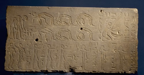 A relief depicting a musicians and acrobats