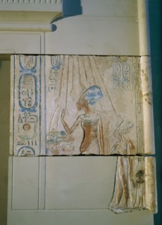Sunk relief from the facade of a shrine showing Akhenaten and Nefertiti offering libations to Aten, the sun god