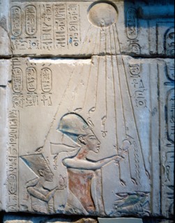 Sunk relief from the facade of a shrine showing Akhenaten and Nefertiti offering libations to Aten, the sun god