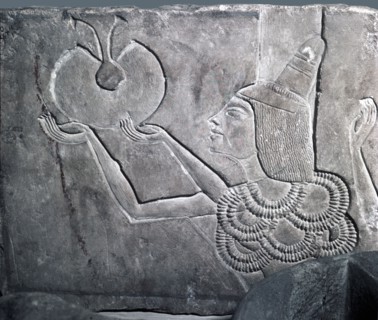 A fragment of a relief, depicting a courtier offering a necklace from a window of appearance