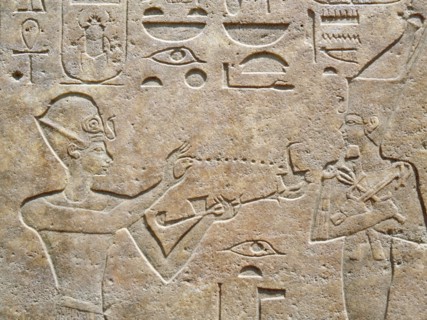 Detail of a relief showing Queen Hatshepsut burning incense to honour a god