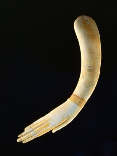 Ivory clapper in the form of a hand
