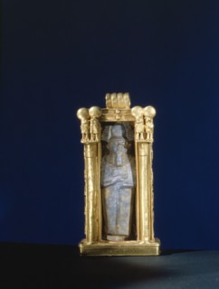 Damaged lapis lazuli amulet of the god Ptah, re used within a gold shrine, from the tomb of Wen Djeba En Djed, senior official of Psusennes I