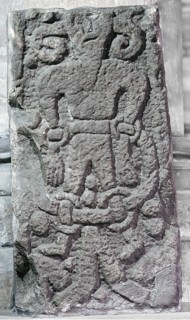 The Bound Devil on a cross at Kirkby Stephen, Cumbria