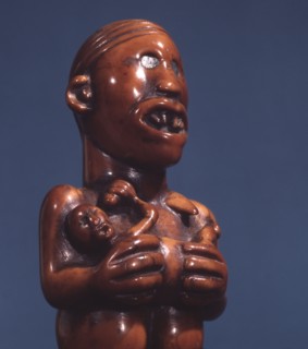 Ivory staff or sceptre finial, a prestige carving for royal or chiefly use, depicting a matrilineal ancestor