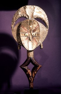 Guardian figures, called mbulu ngulu, are attached to bark boxes or bundles containing bones and other relics of clan or village ancestors, serving to protect them and as a focus for prayers and sacri...