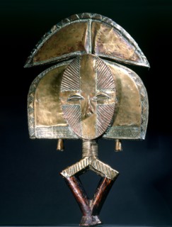 Guardian figures, called mbulu ngulu, are attached to bark boxes or bundles containing bones and other relics of clan or village ancestors, serving to protect them and as a focus for prayers and sacri...