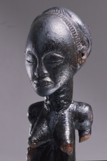 Wooden figure of Luba woman, served as a prestige possesion of a chief or king, illustrating the social and political importance of royal women in Luba society
