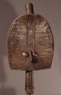 Guardian figures, called boho na bwete attached to bark boxes or bundles containing bones and other relics of clan or village ancestors, serving to protect them and as a focus for prayers and sacrific...