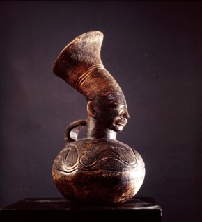 Jar depicting the womens headdress and the lengthened skull achieved by binding the heads of babies among the Mangbetu