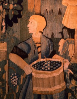 A detail of a tapestry depicting work in the vineyards
