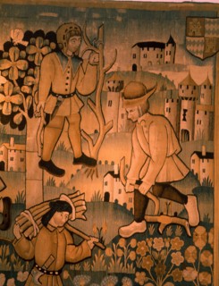A detail of a tapestry depicting work in the vineyards