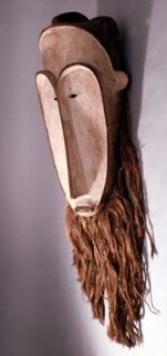 Masks with elongated white faces of this type were used by men of the Fang judiciary association known as Ngil
