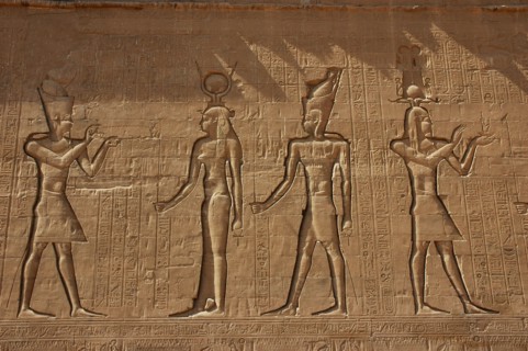 Reliefs on the outer back walls of the temple complex depicting a pharaoh burnign incense for the goddess Isis