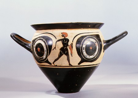 Attic black figure mastoid cup, the painted scene depicting a large pair of eyes, between them a naked youth holding a red cloak