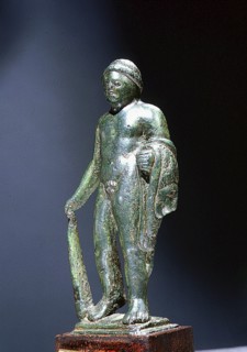 Bronze figure of Heracles, holding the Nemean lion skin over his left arm and a club in his right hand