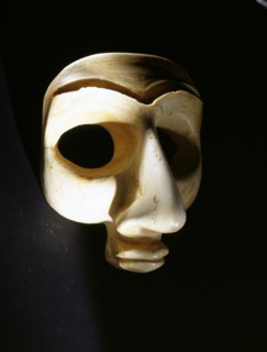 Head, probably from a bearded male votive statuette, with large eye recesses for inlay