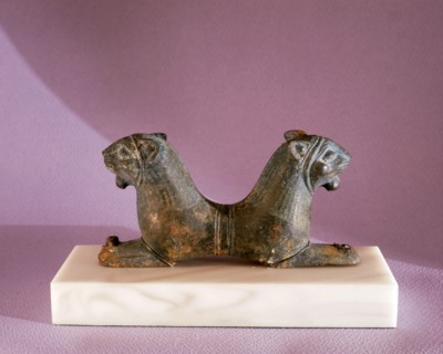 A double headed lion reclining