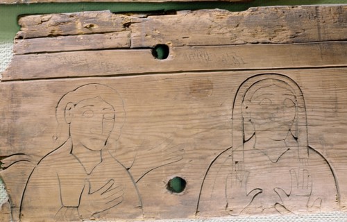 One of the Flatatunga softwood panels incised with a design depicting saints