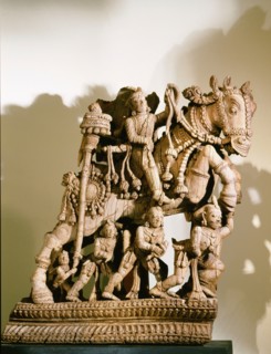 Wood carving of warrior prince on horseback, part of a processional chariot