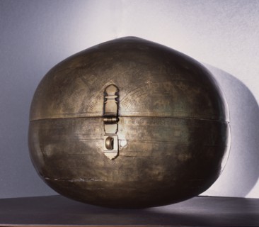 Metalware spherical storage box known as Bhugola or Earth Ball engraved with a representation of the earth as known in Hindu cosmology